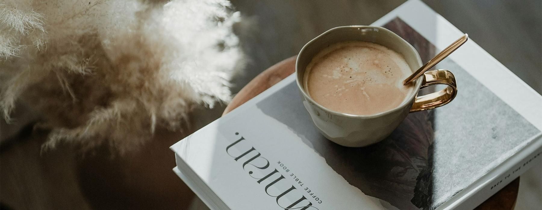 a cup of coffee on a book